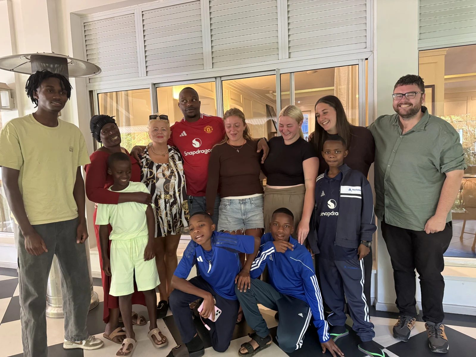 A group gathered together during a community visit