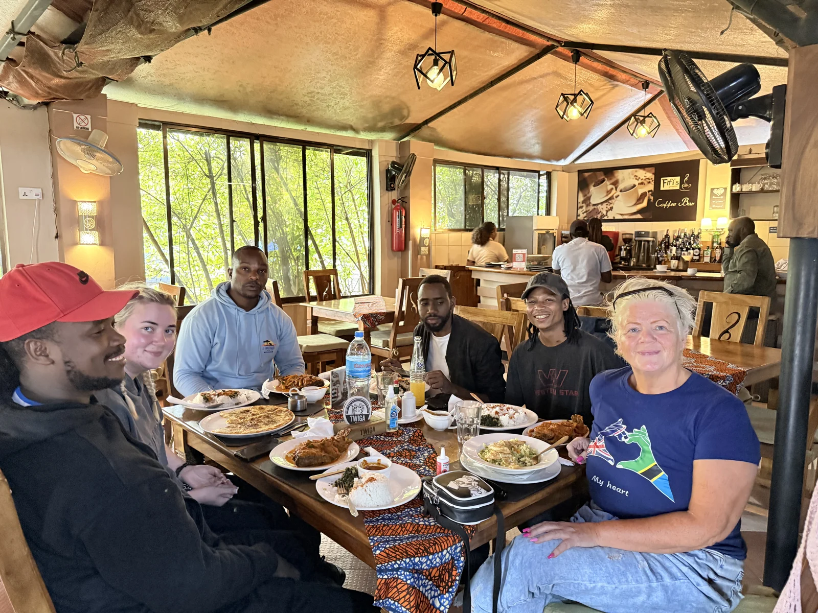 Travellers sharing a meal around a table